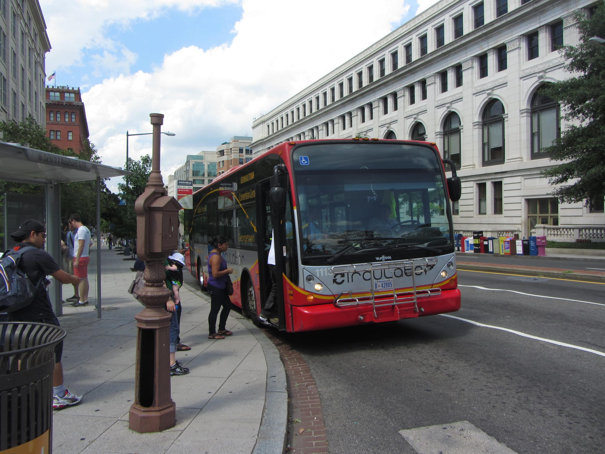 Passengers wait to board a D.C. Circulator.