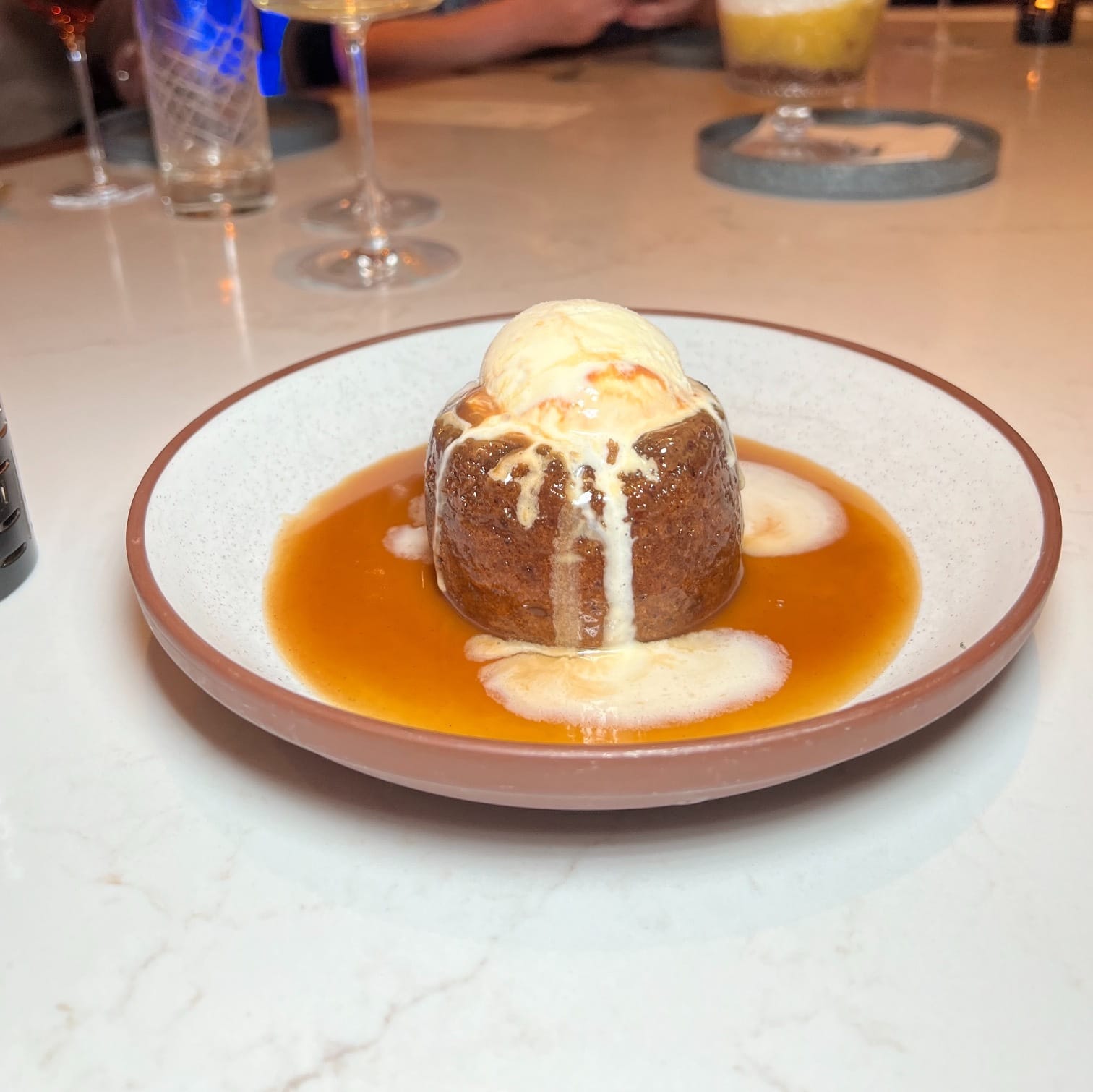 A picture of sticky toffee pudding, a dessert at Gordon Ramsay's restaurant Hell's Kitchen.