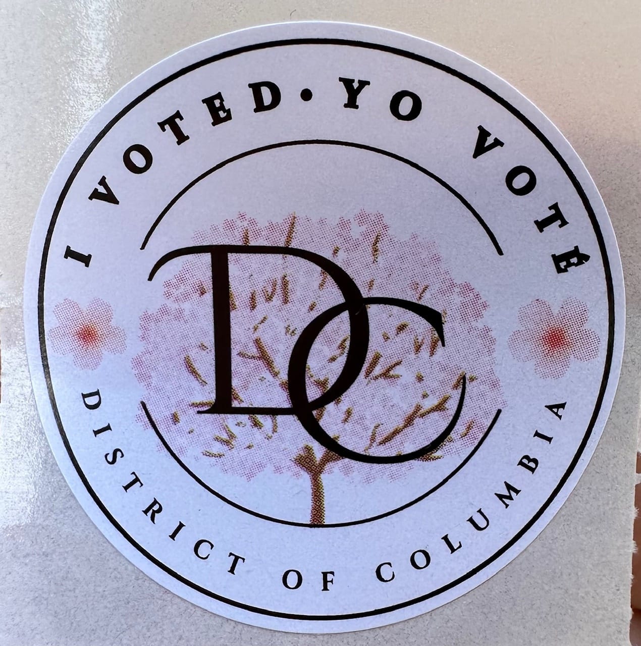 I voted sticker with "DC" overlaid on the image of a cherry blossom tree