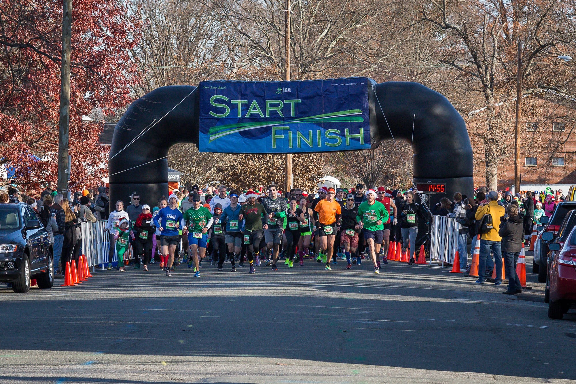 A view of runners at the start line of the Jingle Bell Run in support of arthritis research.