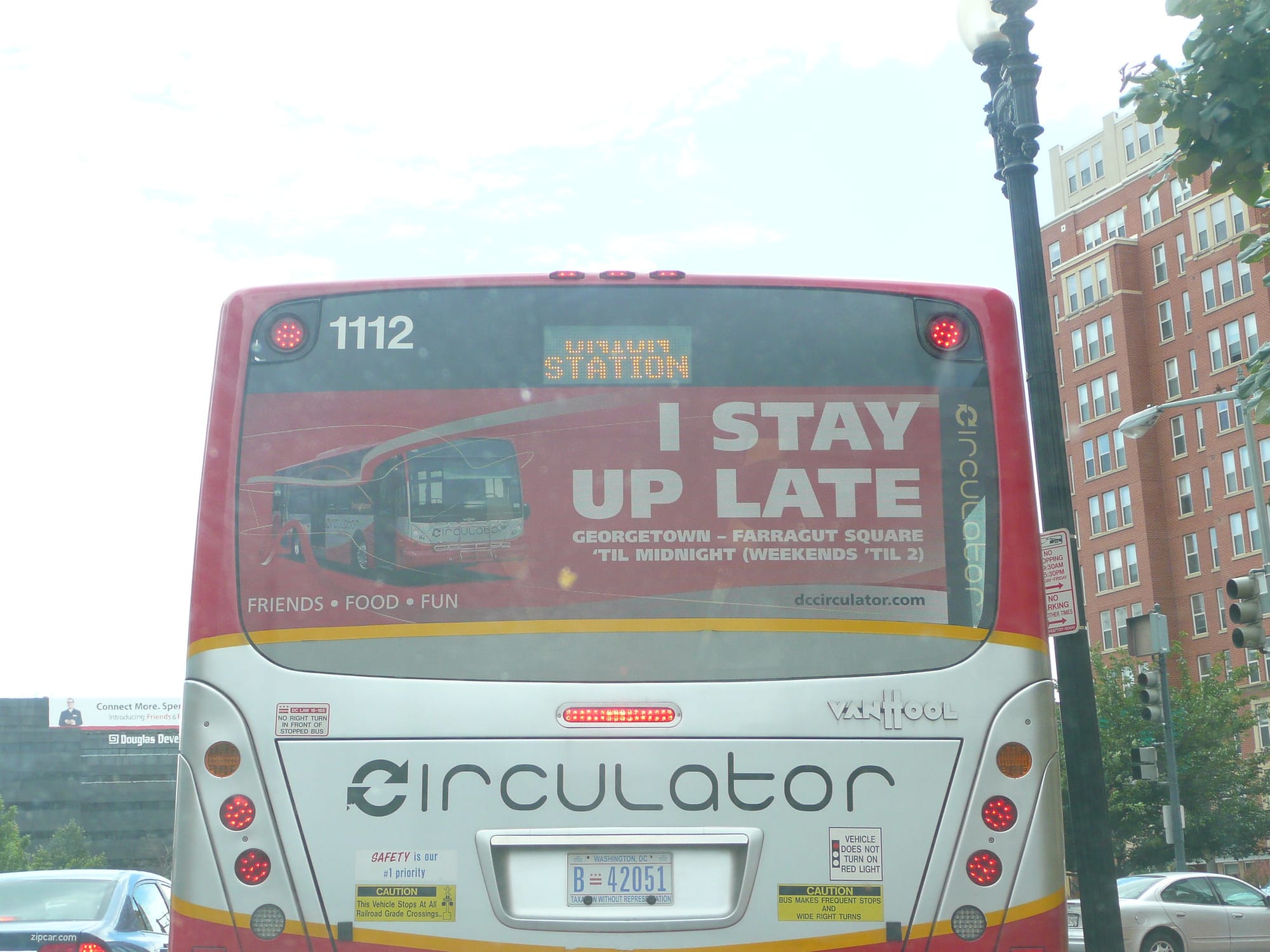 The back of a Circulator bus that reads "I Stay Up Late" 