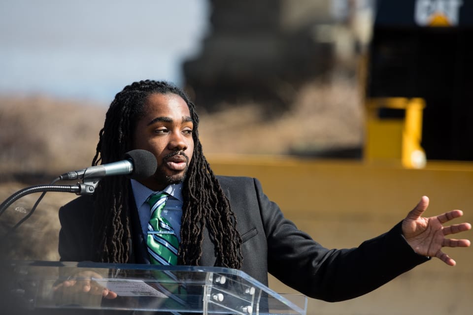 Councilmember Trayon White pictured speaking at a podium.