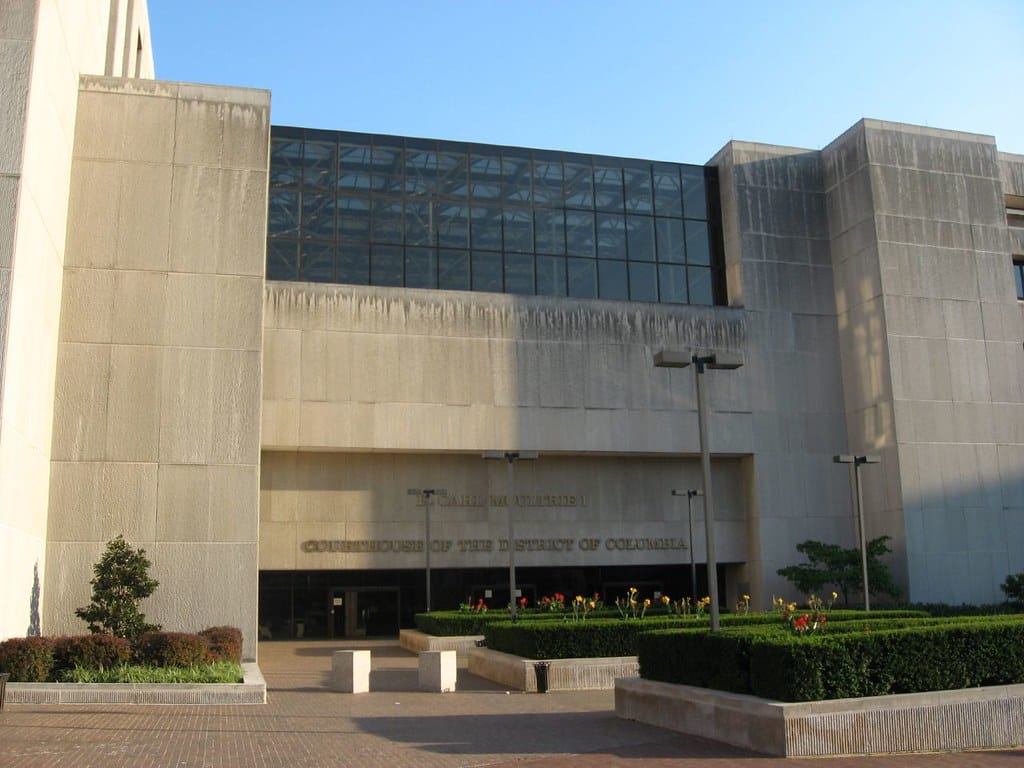 A photo of a large concrete building -- the D.C. Superior Courthouse -- on a sunny day. 