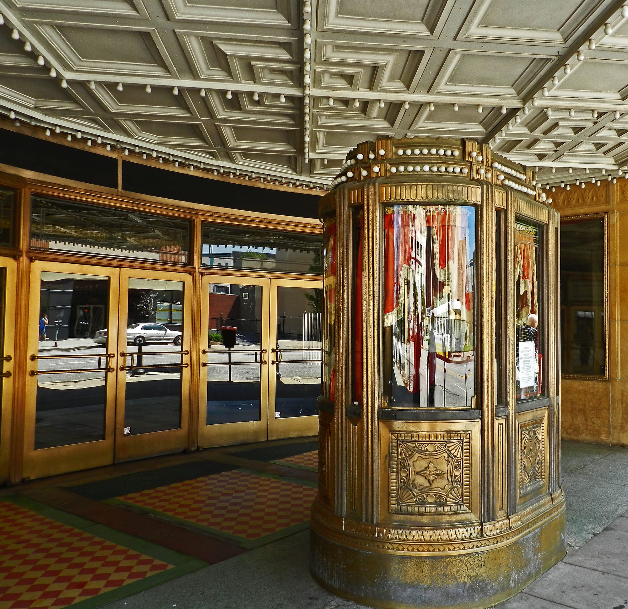 A view of the entrance of Warner Theater, including the double doors.