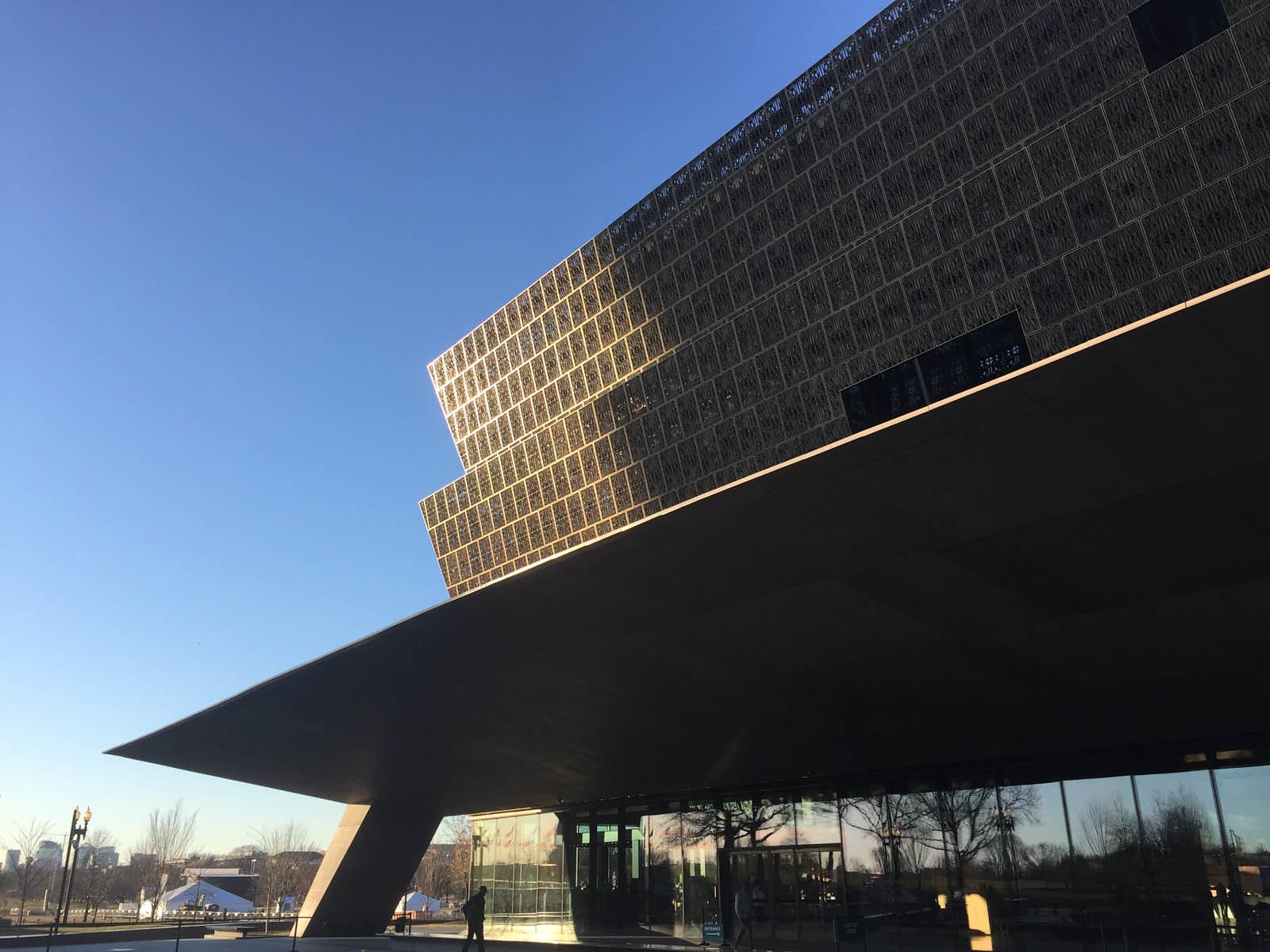 A side angle of the National Museum of African American History and Culture at sunset