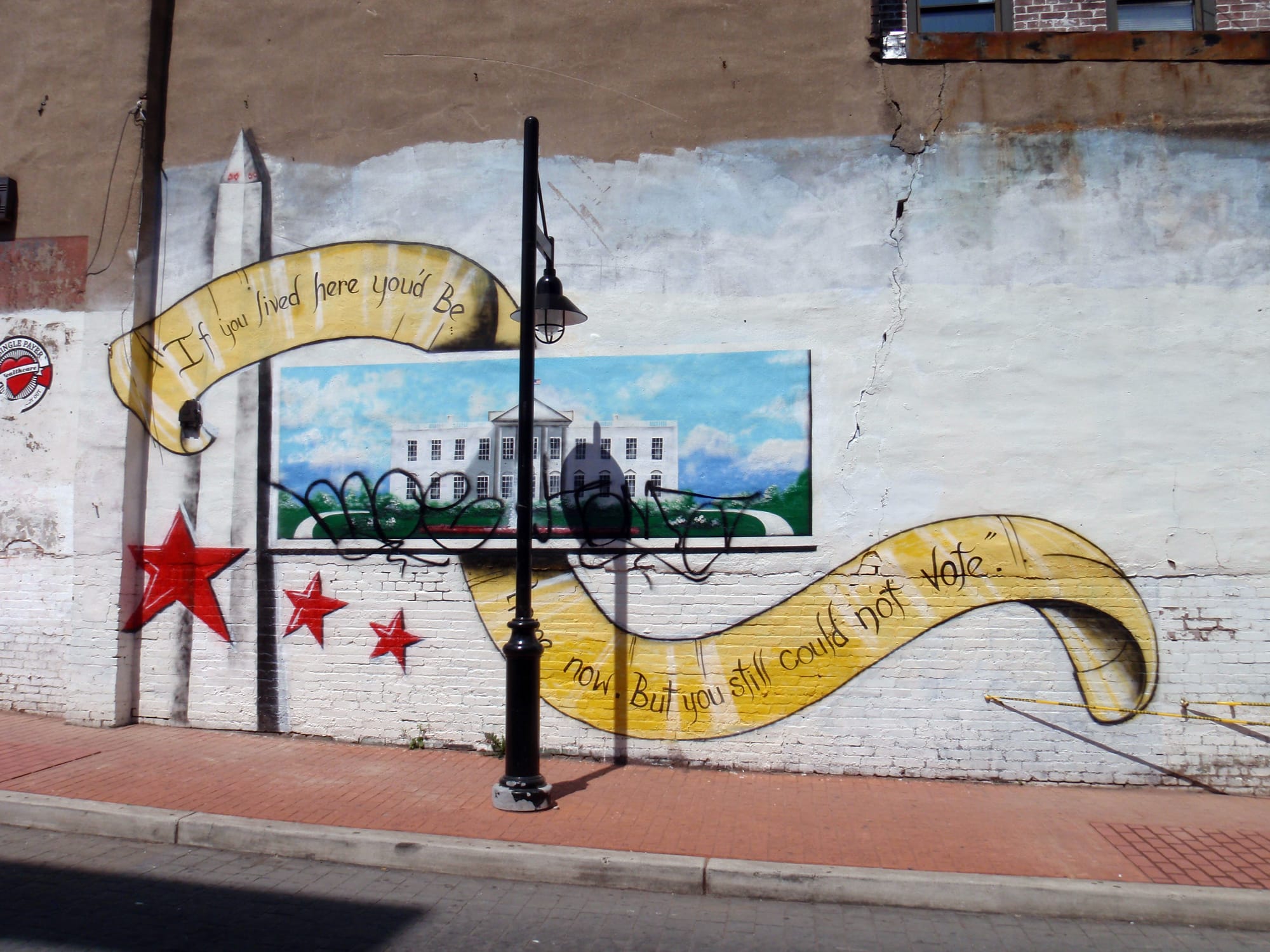 Street art with a mural about statehood. 