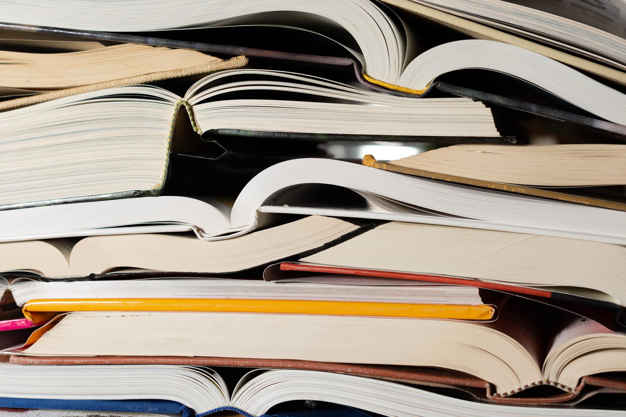 A stack of open books. 