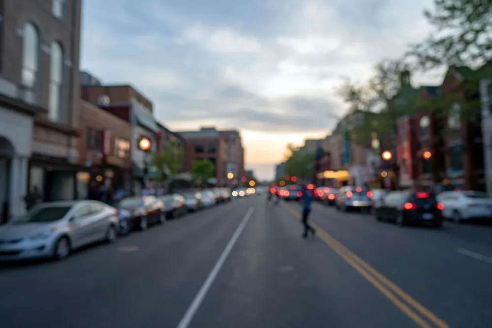 An out-of-focus image of a perosn crossing U Street in Washington D.C. 