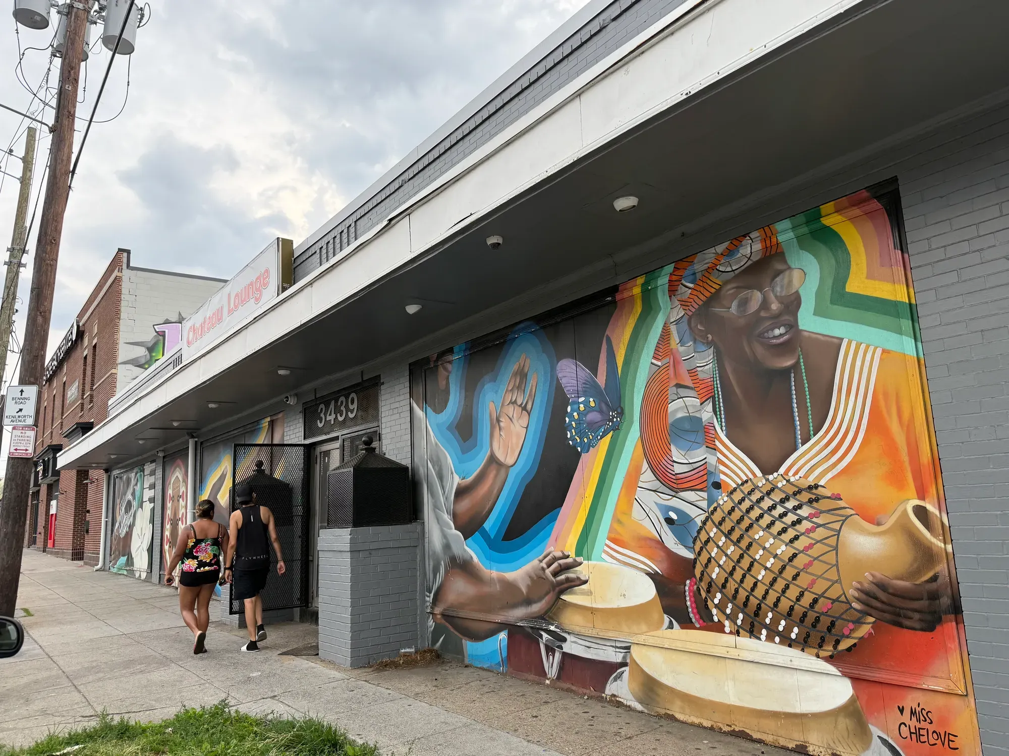 The front of the Chateau Lounge features a colorful mural of two people playing instruments.
