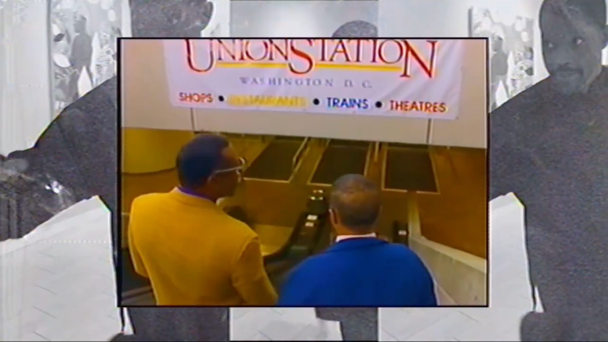 A screenshot from an art video features archival footage of two men on the escalator at Union Station.