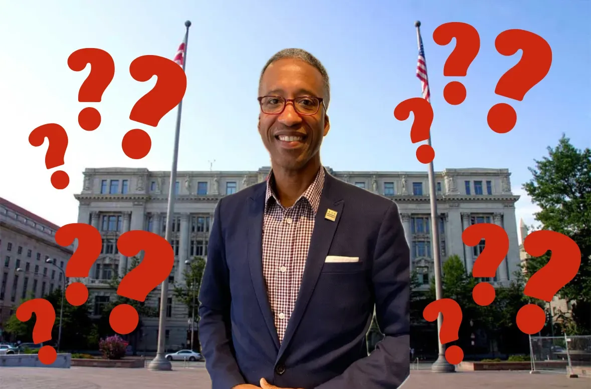 A photo of Kenyan McDuffie in front of the Wilson Building surrounded by red question marks