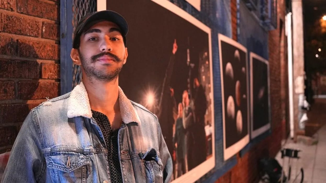 Gael Gomez in a jean jacket on a Mount Pleasant street at night.