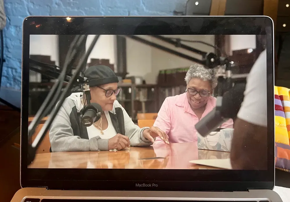 A photograph of a laptop screen featuring the Netflix show Queer Eye