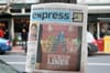 A copy of the defunct Washington Post Express hung up on a pole.