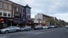 A photo of cars parked along 18th Street Northwest in Adams Morgan, outside restaurants like Andy's Pizza, Bossa, and Tryst.