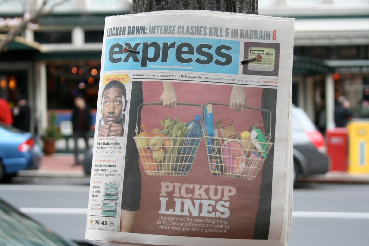 A copy of the defunct Washington Post Express hung up on a pole.