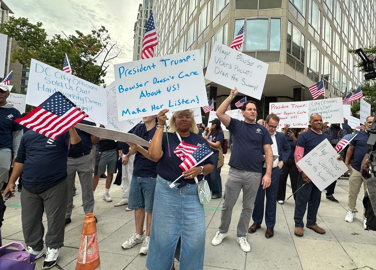 A group of protests hold American flags and signs calling on President Trump to intervene.