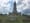 Exterior photo of the George Washington Masonic National Memorial sitting on a grassy hill.