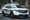 Parked, white FBI truck. 