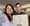 Two people hold a marriage license issued by the District of Columbia. 