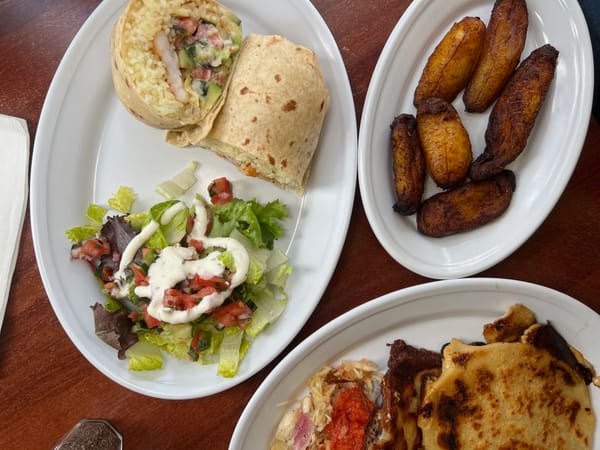 Plates of Mexican food on a restaurant table.